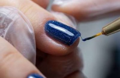 a-close-up-of-the-master-applies-a-gel-polish-with-2025-03-05-03-15-22-utc