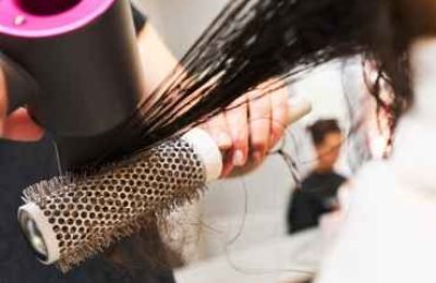 close-up-of-female-hand-holding-hairdryer-2025-03-08-02-55-33-utc