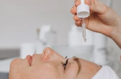 cosmetologist-applying-few-drops-of-moisturizing-o-2025-03-31-12-56-35-utc