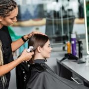 hairstylist-spraying-hair-of-female-client-hairdre-2024-11-09-03-30-16-utc (1)