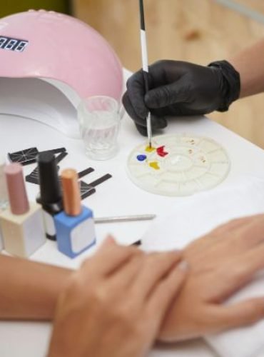 painting-nails-during-professional-manicure-sessio-2025-02-11-14-04-33-utc