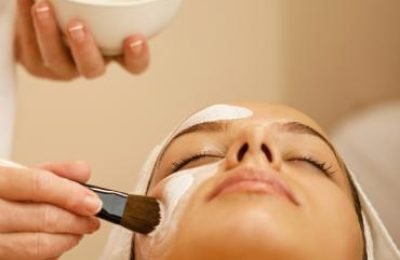 unrecognizable-beautician-applying-mask-on-woman-s-2024-12-13-17-40-58-utc